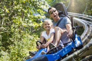 father and daugther on a roller coaster