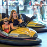 girls riding bumper cars