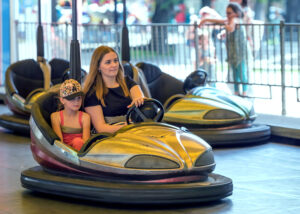 girls riding bumper cars